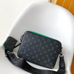 Alternative view of p530M26052 Black Floral Green N40438 Embossed Blue M69443 M58040 Silk-Printed M50017 Black Grid M50027 White Grid M45965 Yellow Embroidered M30848 Blue Floral M69827 Embossed Black M80401 Black Grid Leather M20665 White M46104 Embossed Silver M45730 Embossed Blue M46266 Vintage Floral Trio Messenger Bag crafted from Monogram Eclipse canvas and Monogram Eclipse Reverse canvas. The iconic tonal gray pattern accentuates the lines of this versatile patchwork design. Beyond its traditional crossbody functionality, it includes a detachable zippered pouch and a coin purse attached to the strap.Dimensions: 25.0 x 18.5 x 7.0 cm